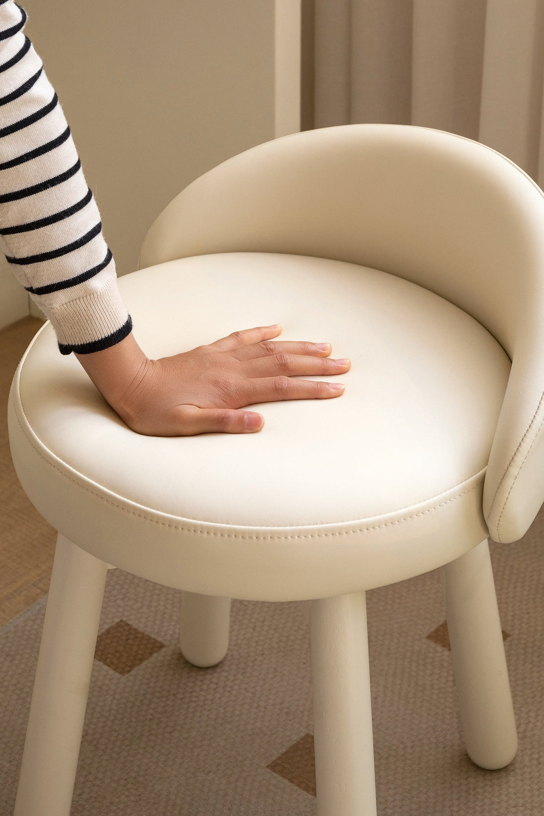 Scratch-resistant cream dining chair with soft padded seat, designed for easy-care Singapore homes, HDB flats, condos, and dining spaces.