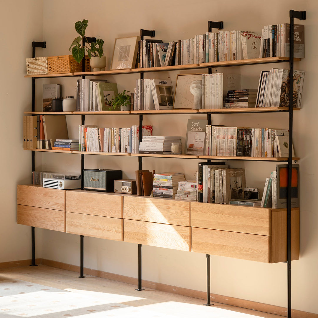 Modern wall-mounted shelves with integrated wooden drawers and black metal frame, ideal for organizing books, decor, and accessories, blending functionality with minimalist aesthetics.