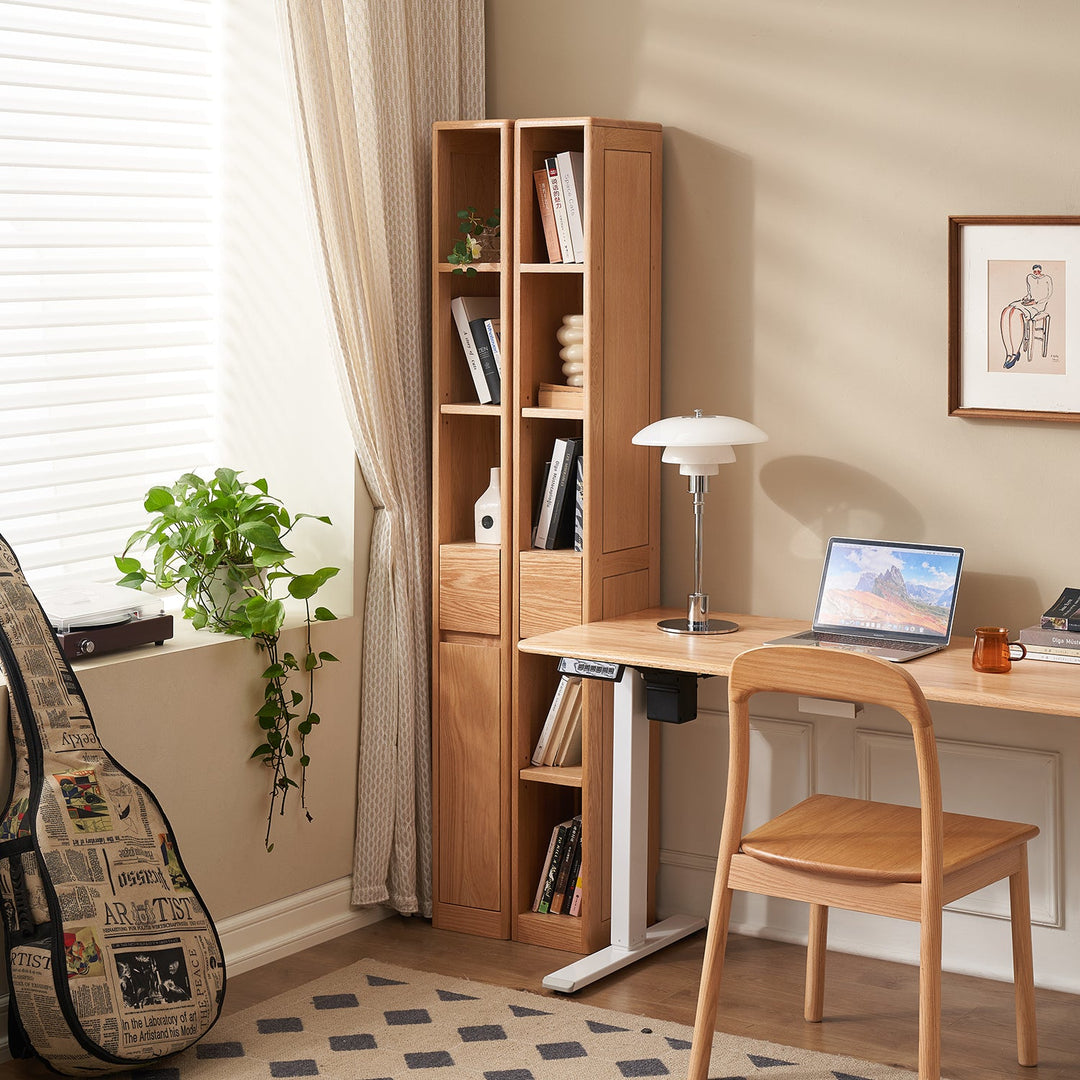 Compact wooden bookshelf with open and closed compartments, ideal for organizing books and decor in small study or living spaces.