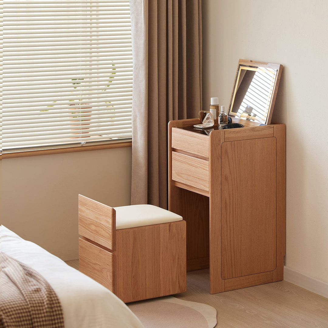 Compact wooden dressing table with a foldable mirror and cushioned stool, perfect for minimalist bedroom setups and efficient space use.