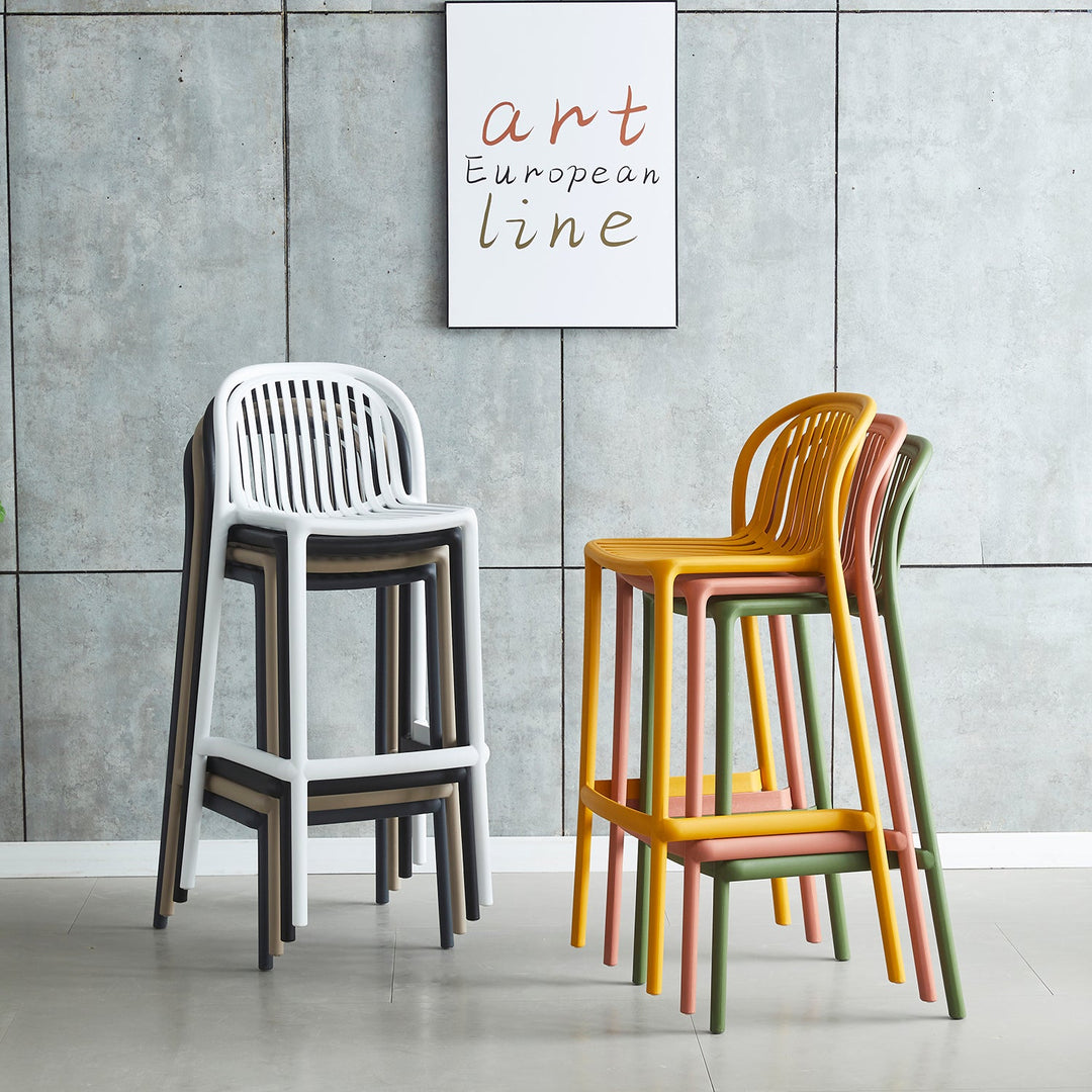 Modern stackable bar chairs in white, yellow, pink, and green hues, featuring ergonomic slatted backs and durable frames, ideal for stylish indoor or outdoor settings.