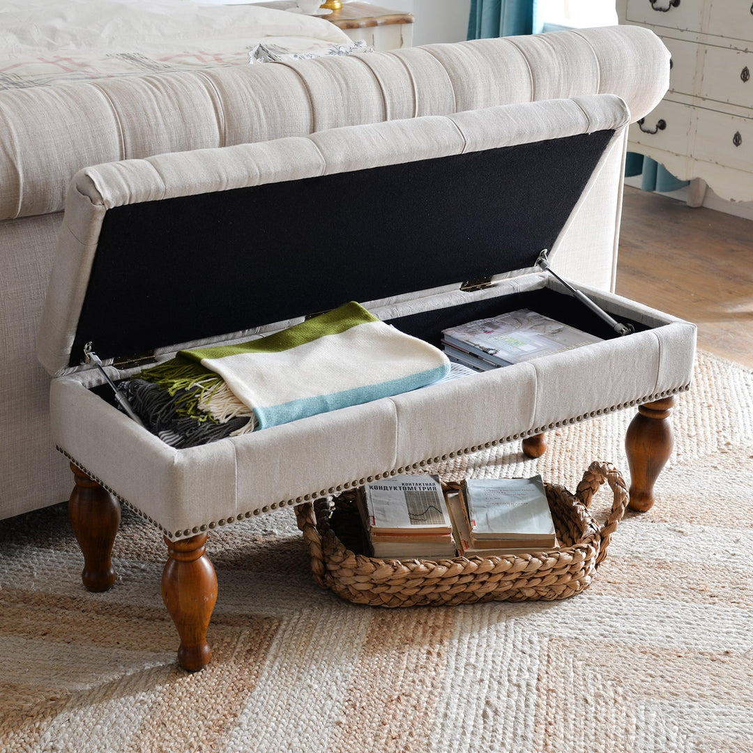 Elegant upholstered storage bench with a lift-up lid, featuring sturdy wooden legs and spacious hidden compartments, perfect for decluttering bedrooms or living spaces.