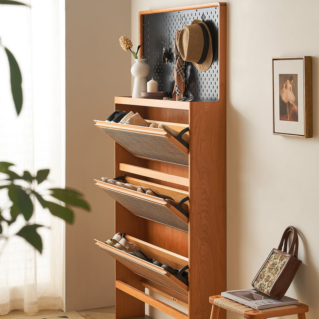 Loft Home Tilt-Out Door Storage collection, elegant wooden cabinet with black pegboard and tilt-out compartments, perfect for shoe organization.