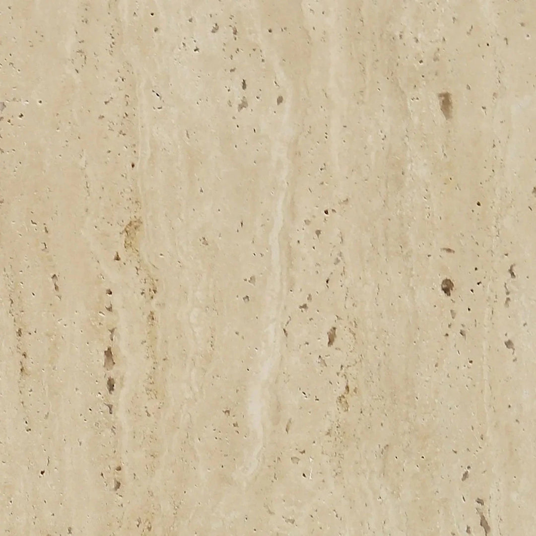 Travertine stone furniture surface with natural porous texture, showcasing timeless elegance and organic appeal for modern interiors by Loft Home.
