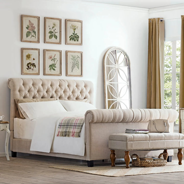 Elegant upholstered bed with tufted headboard in a cozy, light-filled bedroom, featuring classic decor elements and soft bedding, linking to Loft Home's upholstered beds collection.