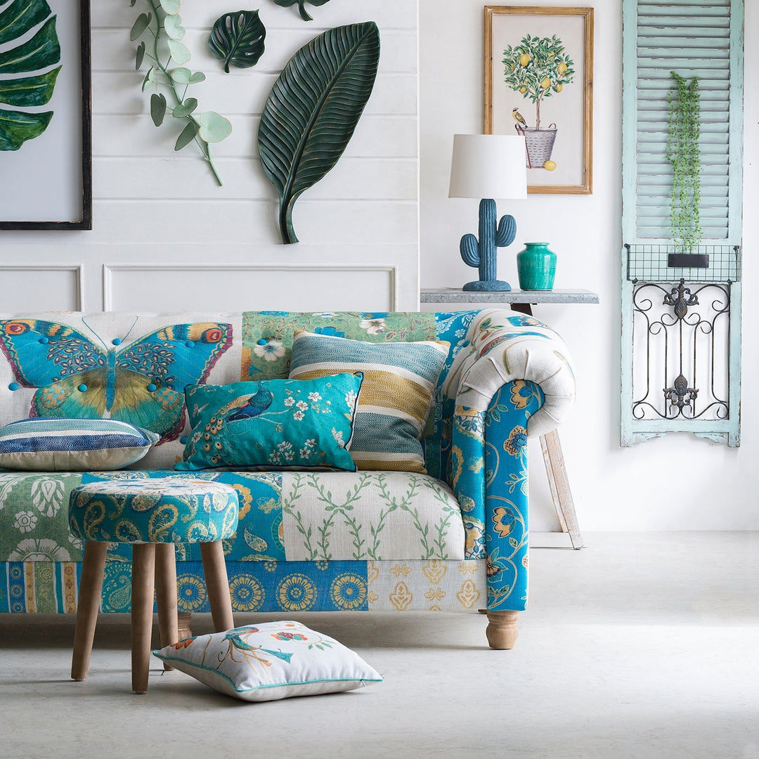 Loft Home upholstered sofa with vibrant floral and butterfly patterns, perfect for adding charm and elegance to living rooms in the Upholstered Sofas collection.