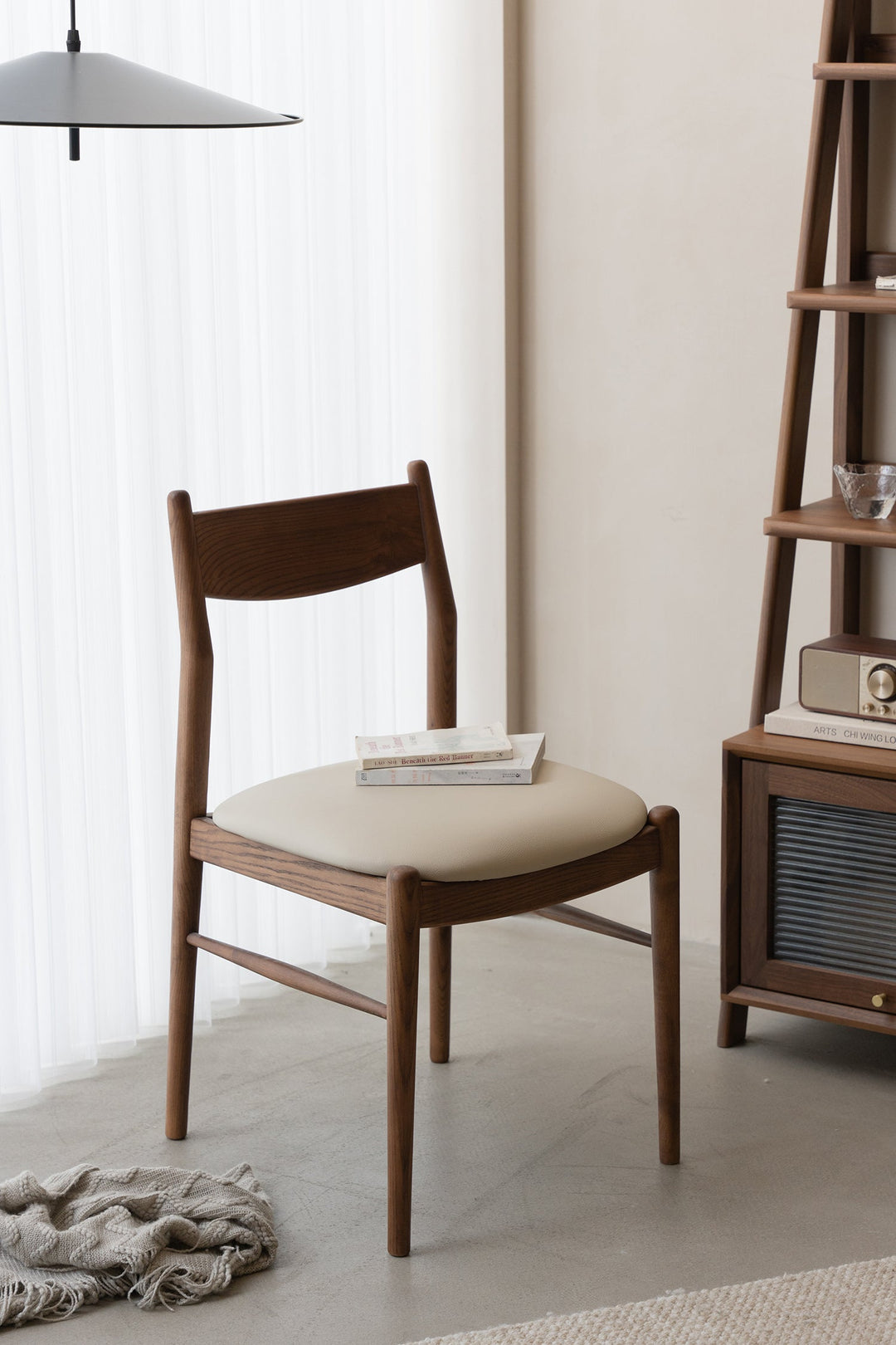 Wabi-sabi premium wooden dining chair with padded seat, styled in a calm minimalist interior, bringing warm natural elegance to Singapore homes.