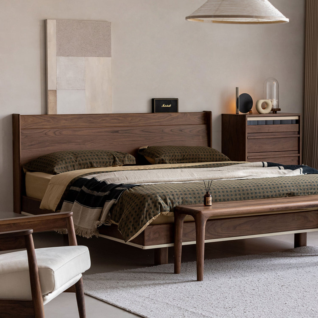 Wabi-sabi premium solid wood bed and matching furniture set in a calm minimalist bedroom, bringing natural warmth and refined comfort to Singapore homes.
