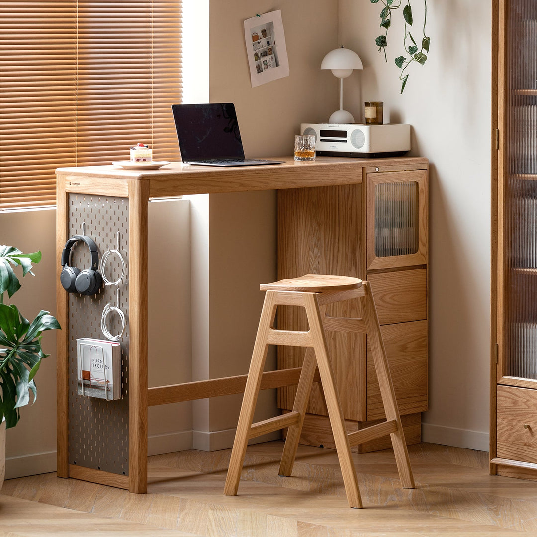 Minimalist wooden bar chair with a natural oak finish, paired with a matching wooden bar table featuring storage compartments and pegboard organizers, ideal for cozy home workspaces or kitchens.