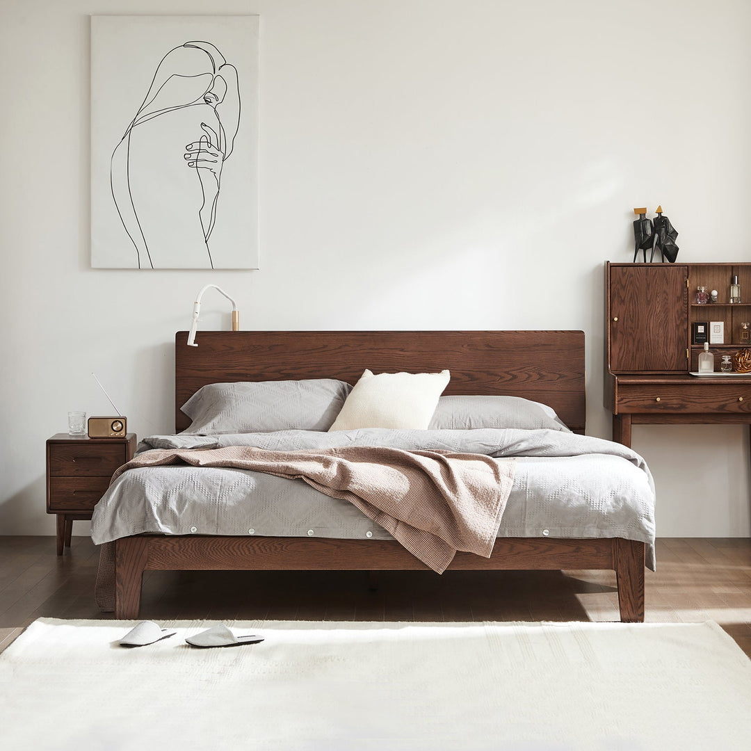 Solid wood bed frame with a minimalist design, styled with neutral bedding and decor, perfect for creating a cozy and modern bedroom atmosphere.