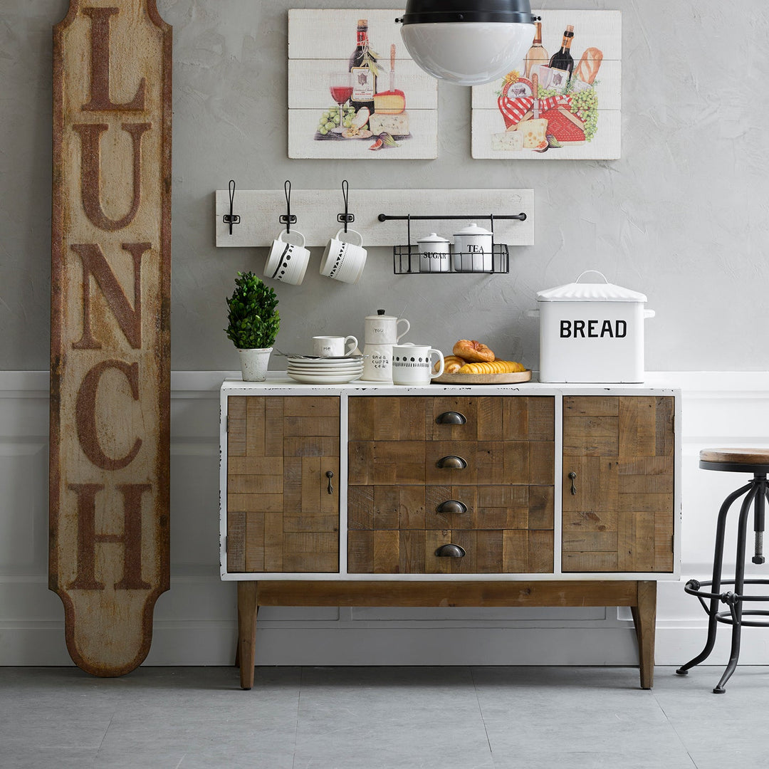 Rustic wooden sideboard with drawers and cabinets, styled with kitchen decor, perfect for farmhouse or vintage-inspired dining spaces.