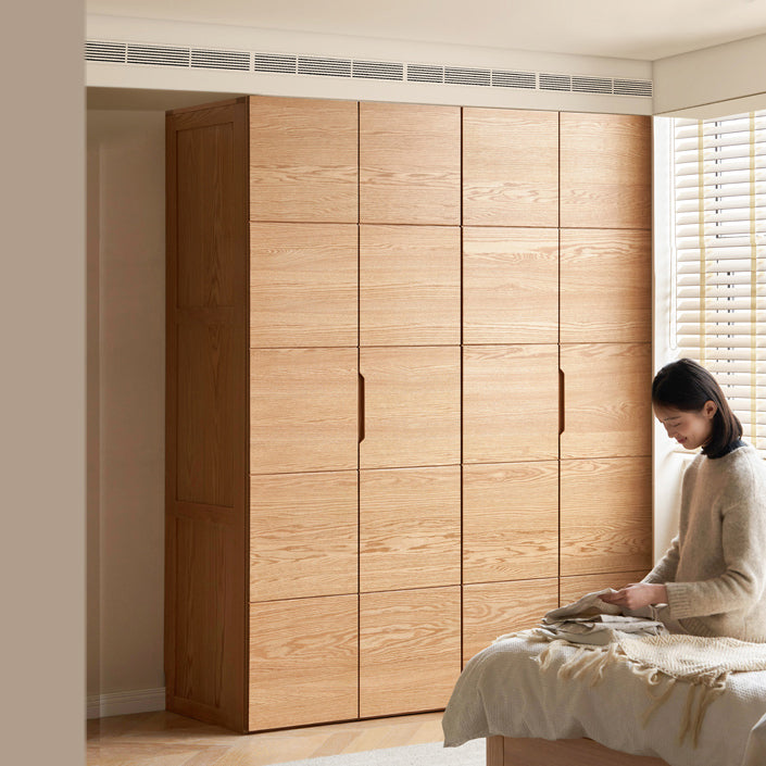 Modern wooden wardrobe with clean lines and handle-free design, blending seamless storage with contemporary aesthetics for a minimalist bedroom.