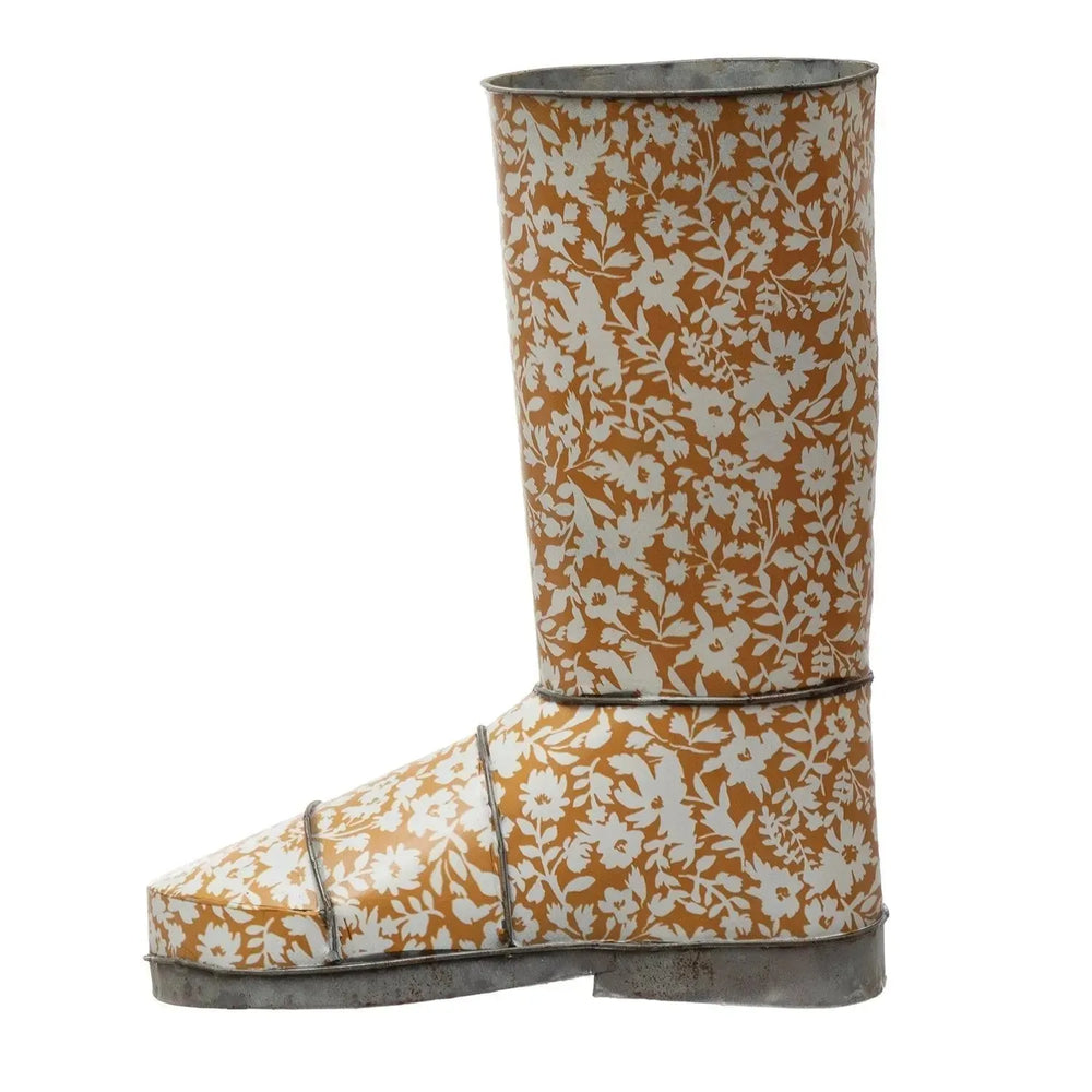 10-1/2"l x 5-1/2"w x 12-1/2"h decorative metal garden boot w/ floral pattern, mu in white background.