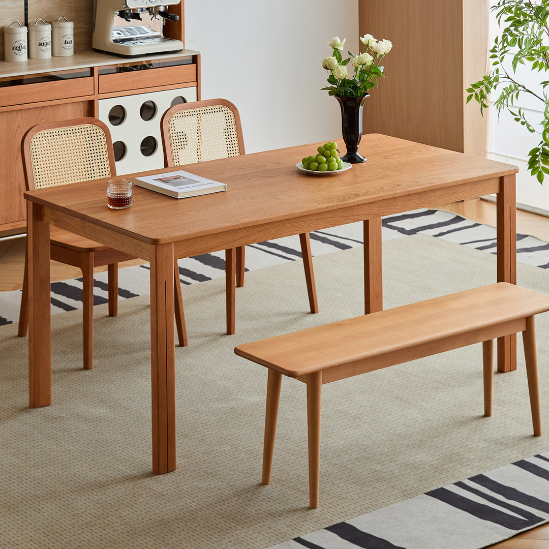 Scandinavian cherry wood dining table eclipse in still life.