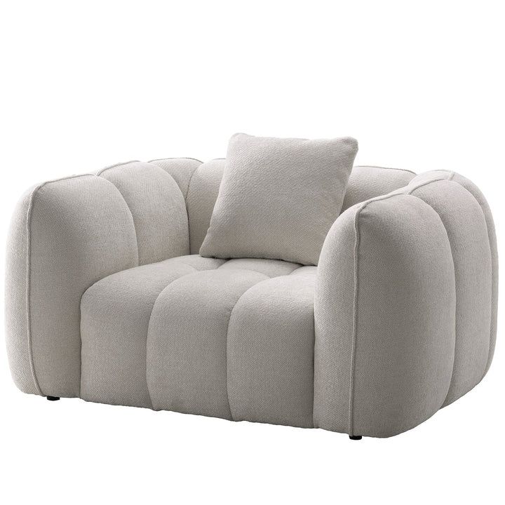 Cream mixed weave fabric 1 seater sofa puddy in white background.