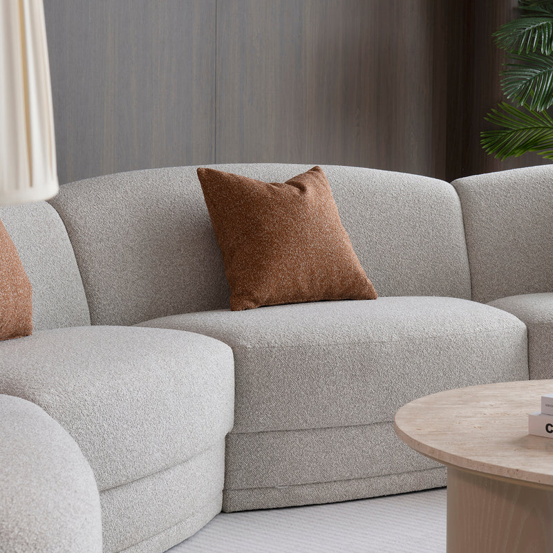 Modern boucle fabric modular sectional 4 seater sofa curva in real life style.