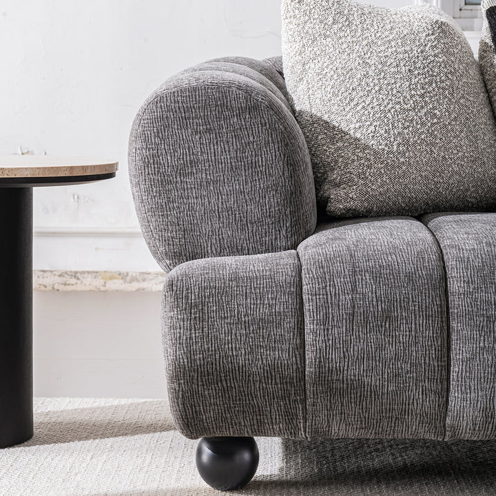 Modern velvet fabric 3 seater sofa raven with context.