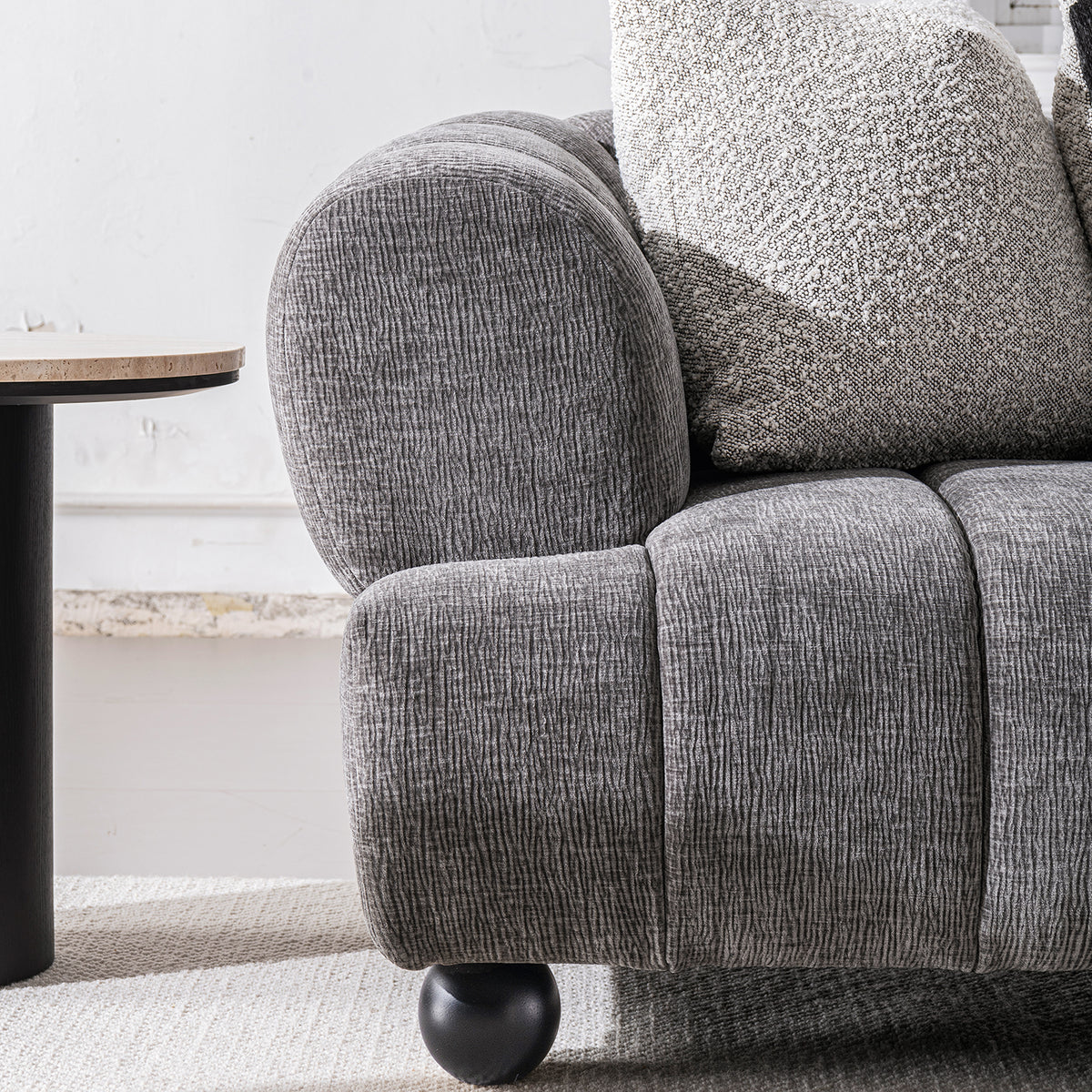 Modern velvet fabric 2 seater sofa raven with context.