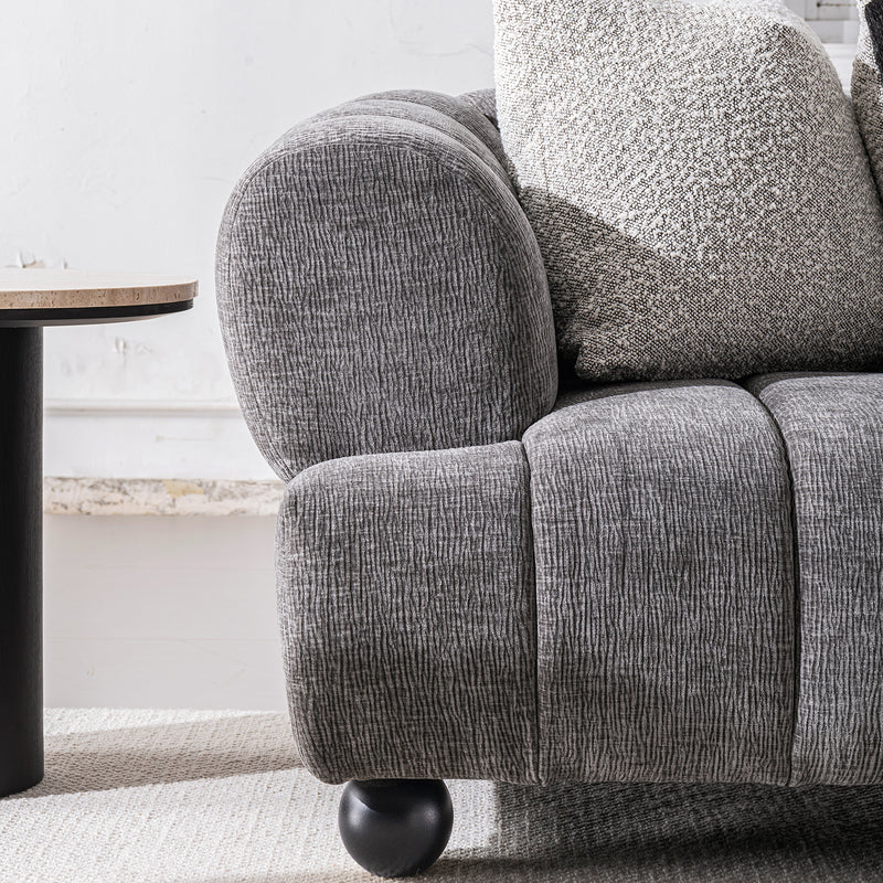 Modern velvet fabric 2 seater sofa raven with context.