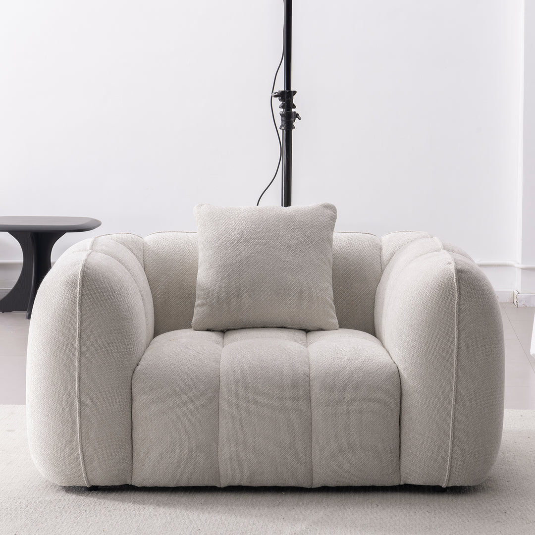 Cream mixed weave fabric 1 seater sofa puddy in real life style.