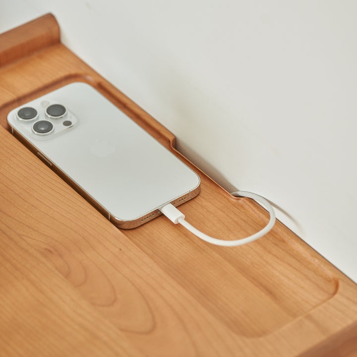 Scandinavian cherry wood side table shell in still life.
