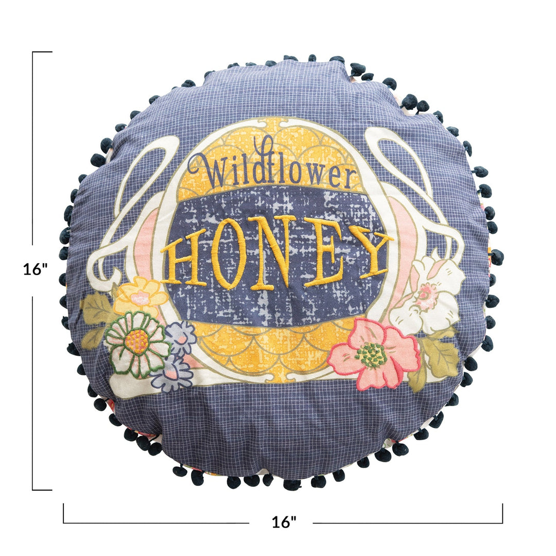 16" round cotton pillow w/ embroidery, printed back & pom pom trim, multi color material variants.