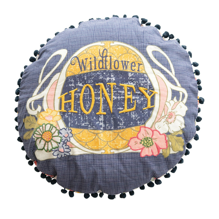 16" round cotton pillow w/ embroidery, printed back & pom pom trim, multi color in white background.