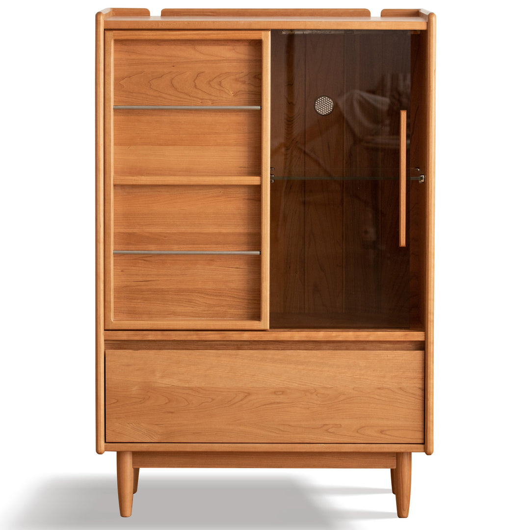 Scandinavian cherry wood side cabinet vista in white background.