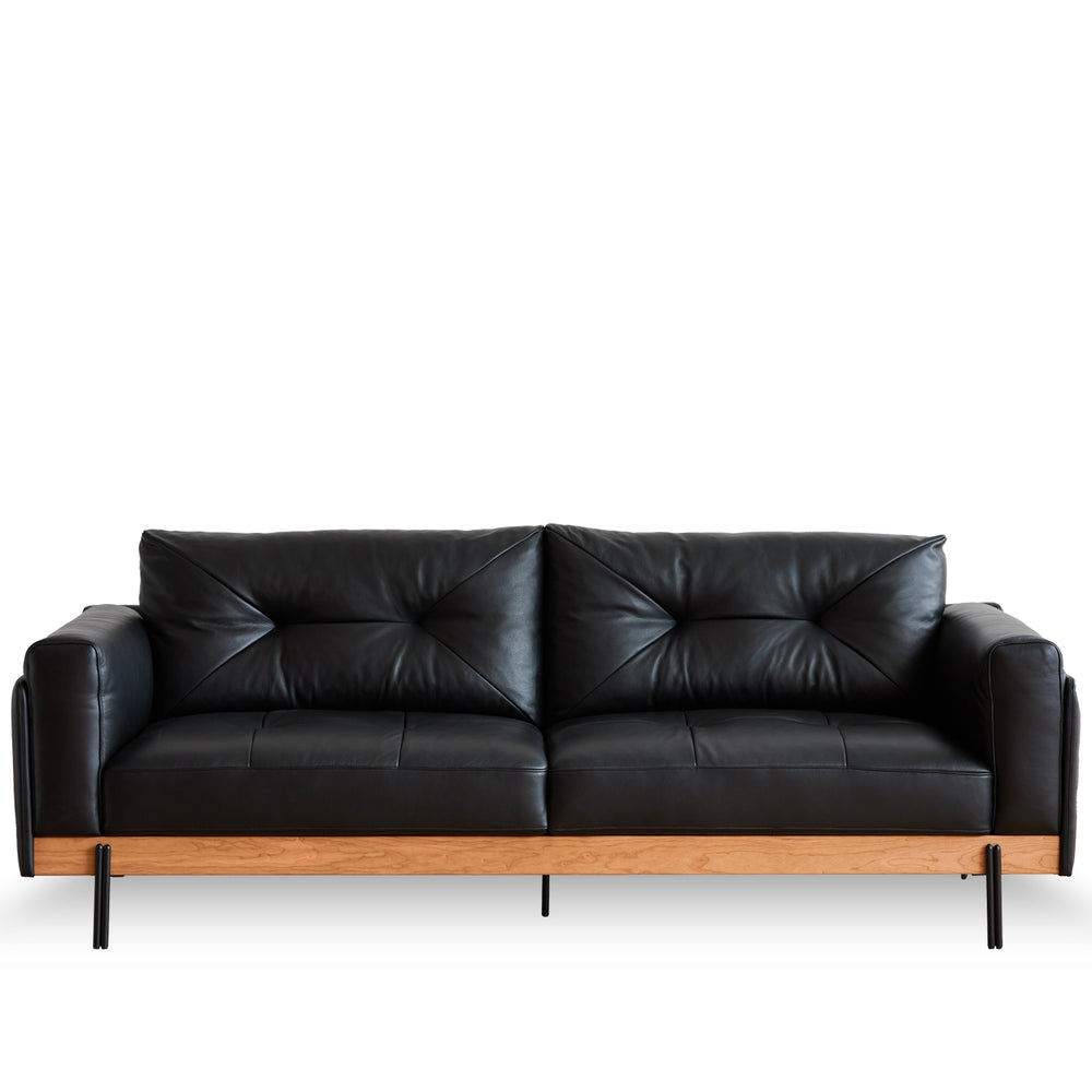 Scandinavian microfiber leather 3 seater sofa black in white background.