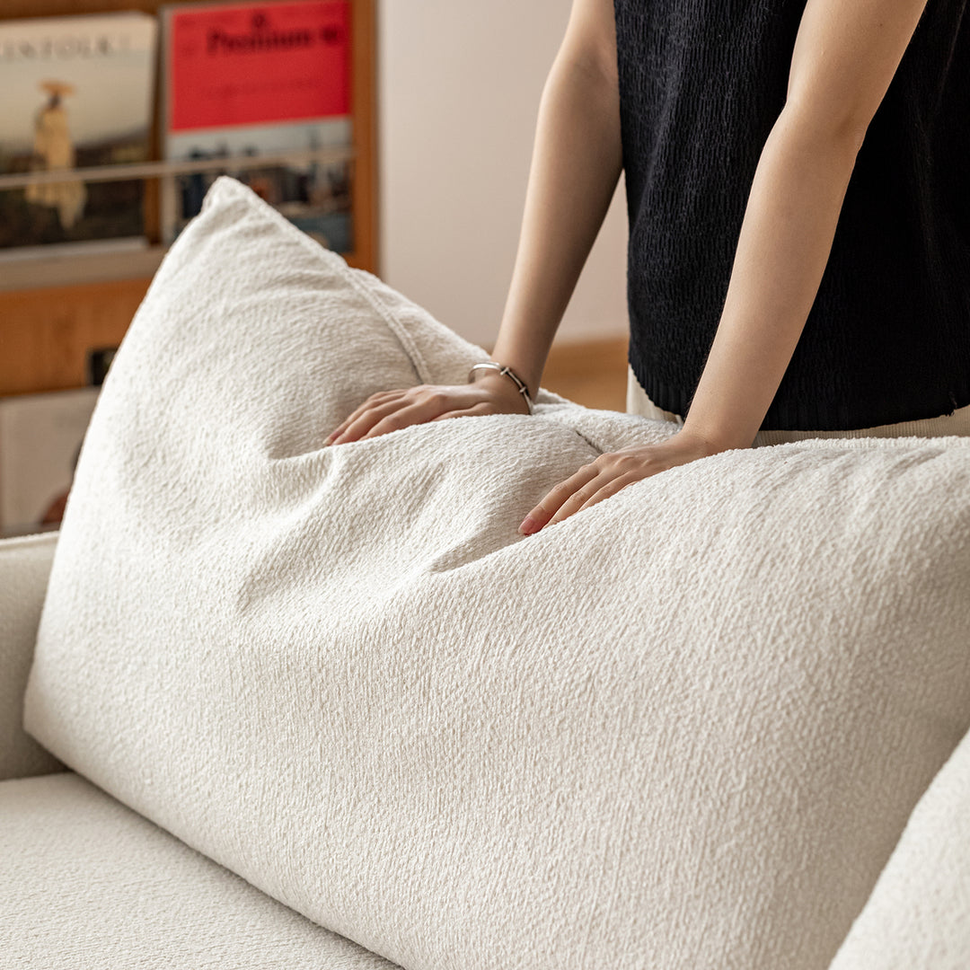 Scandinavian premium boucle fabric sofa cover in close up details.