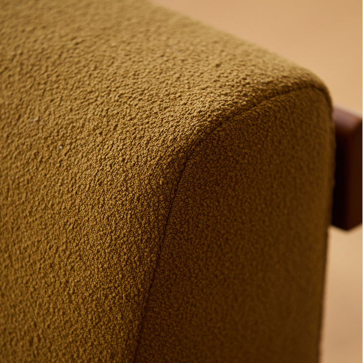 Scandinavian premium boucle fabric sofa cover in still life.