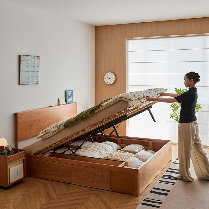 Scandinavian cherry wood lift-up storage bed with drawer kangaroo in real life style.