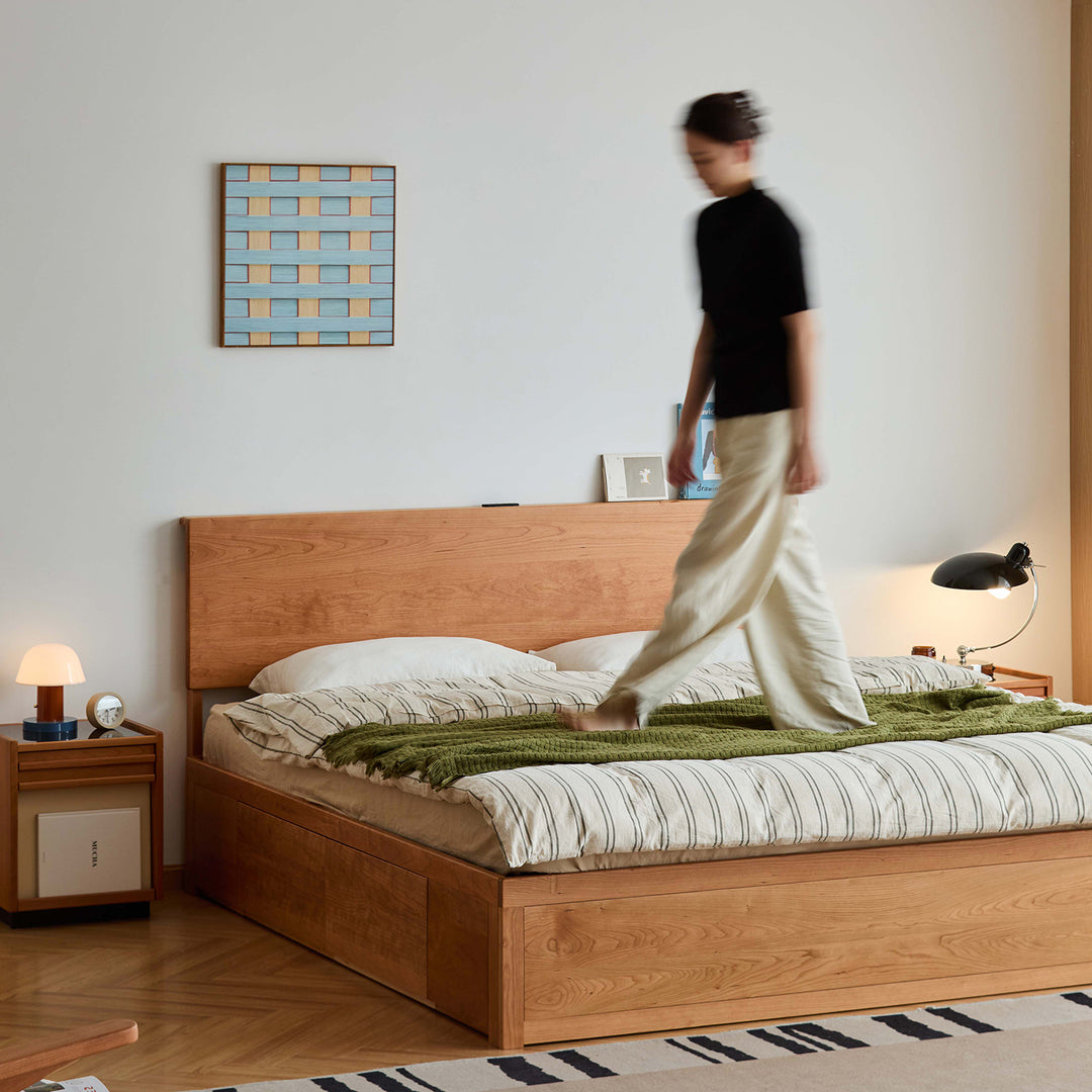 Scandinavian cherry wood lift-up storage bed with drawer kangaroo in close up details.