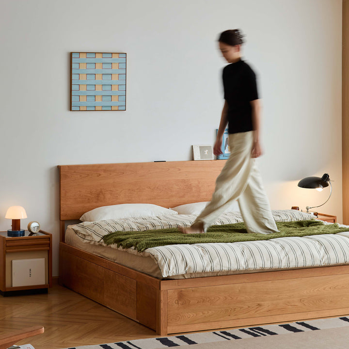 Scandinavian cherry wood lift-up storage bed with drawer kangaroo in close up details.