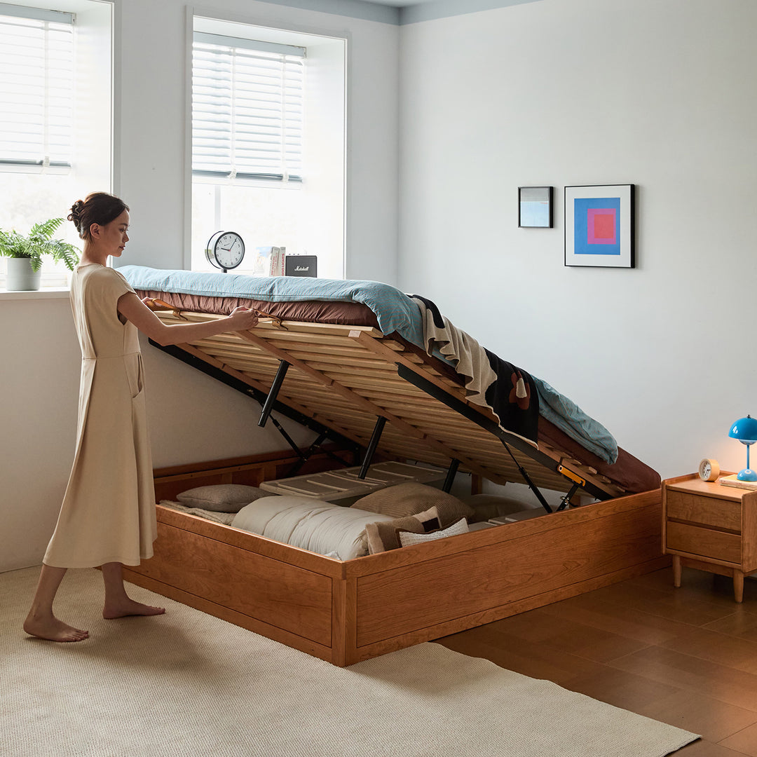 Scandinavian cherry wood lift-up storage platform bed with drawer kangaroo in real life style.