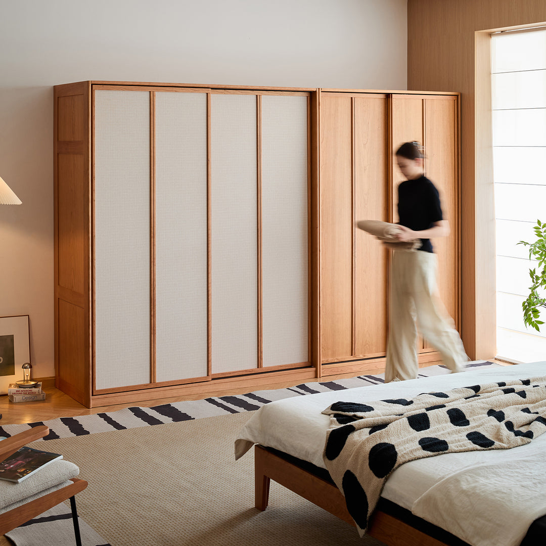 Scandinavian cherry wood sliding door wardrobe kangaroo in real life style.