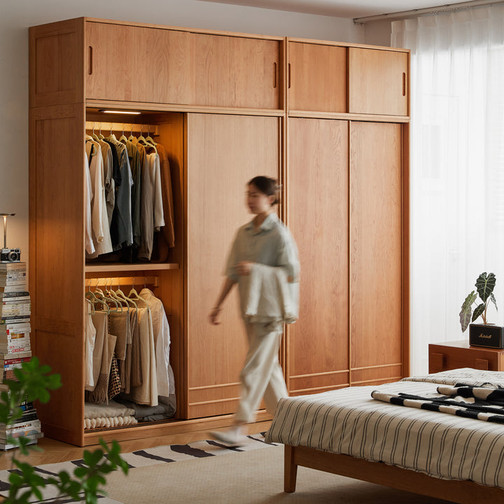 Scandinavian cherry wood sliding door wardrobe autumn in white background.