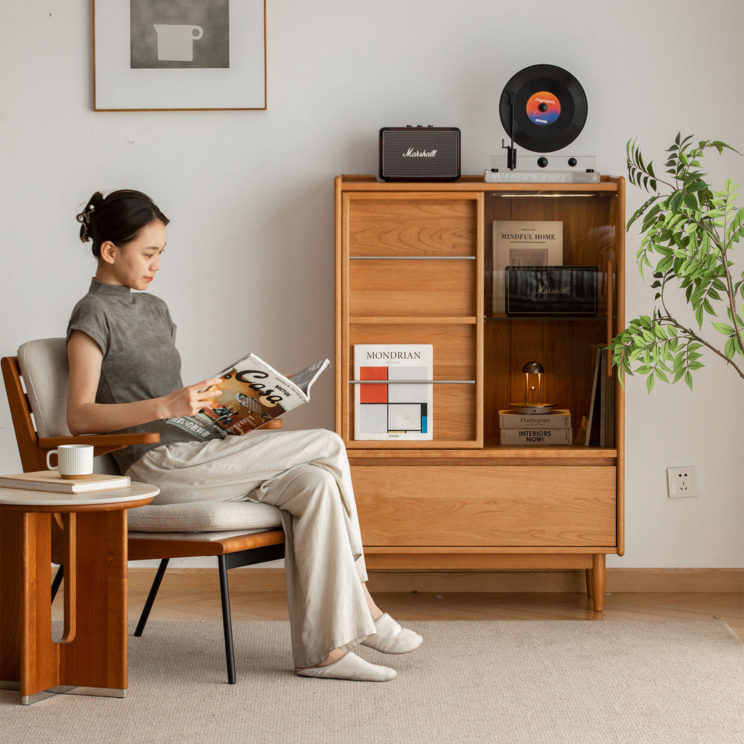 Scandinavian cherry wood side cabinet vista with context.