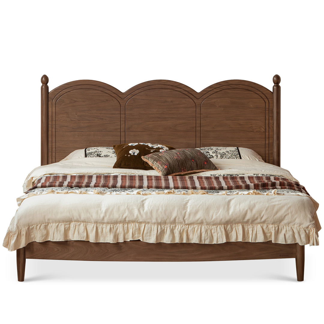 Vintage walnut wood bed midsummer in still life.