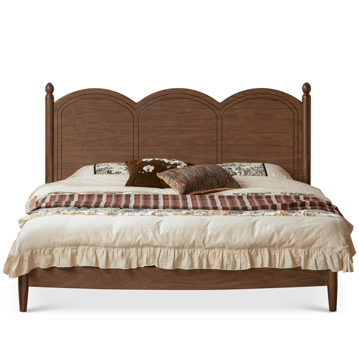 Vintage walnut wood bed midsummer in still life.
