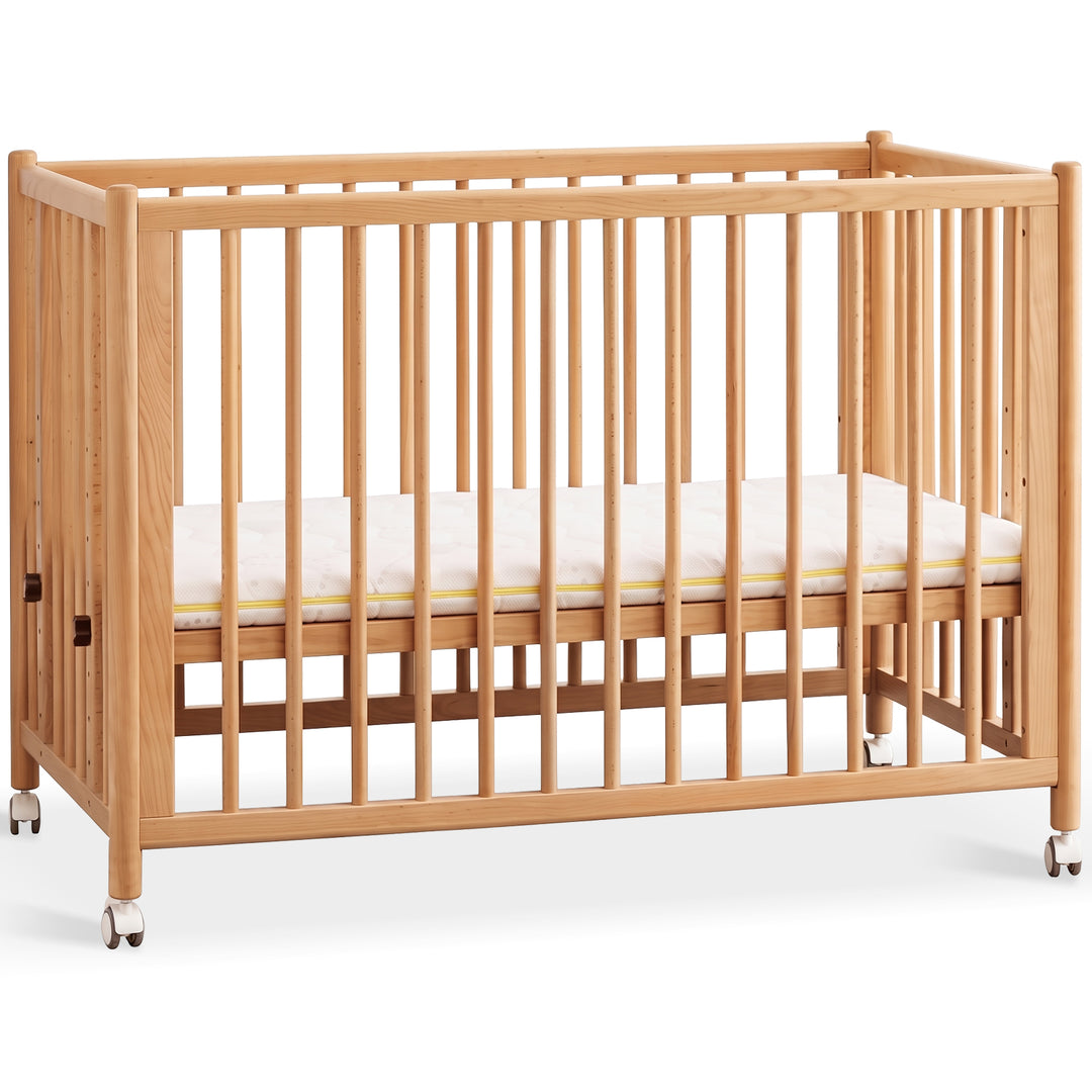 Scandinavian beech wood bed side baby crib with wheels ember in white background.