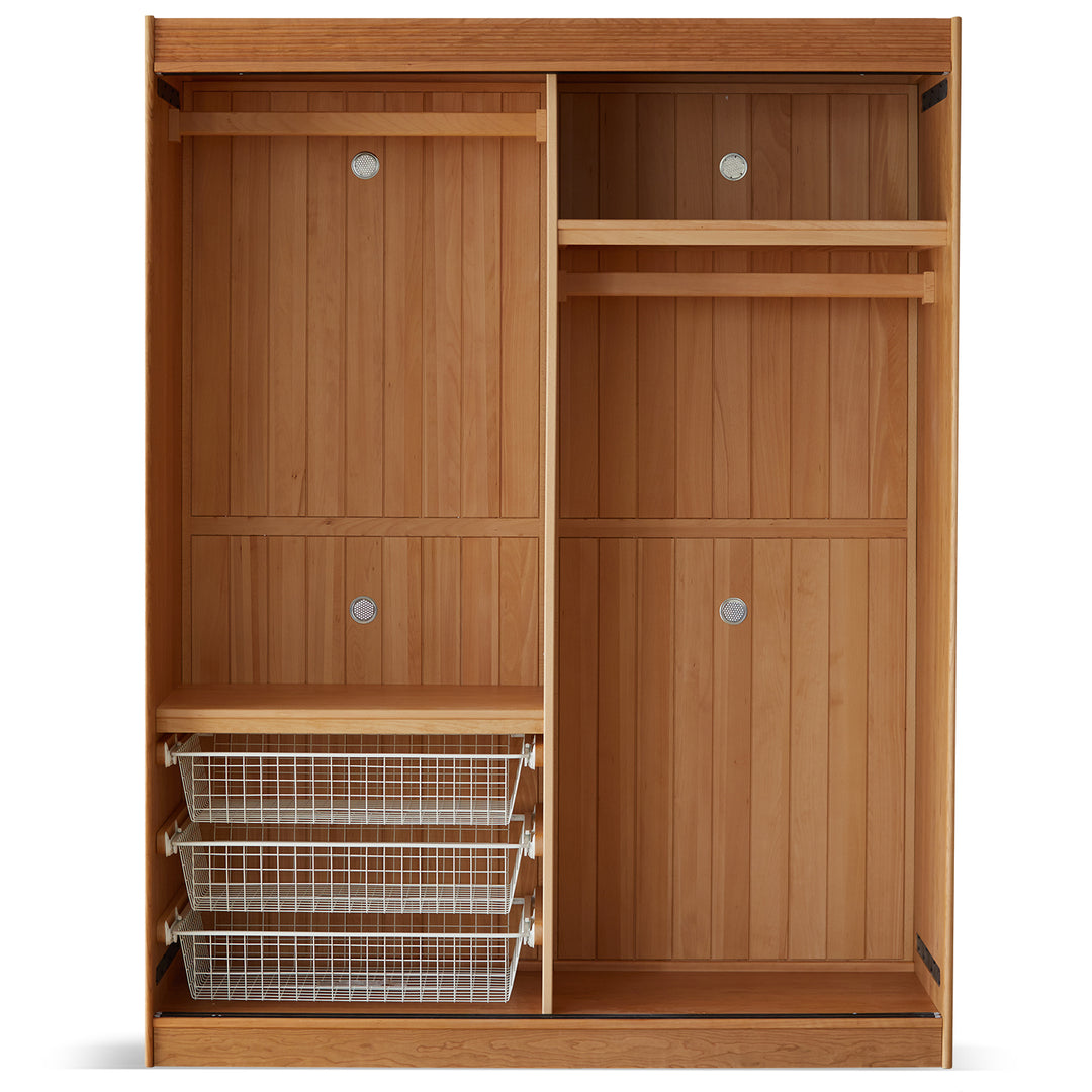 Scandinavian cherry wood sliding door wardrobe nava in still life.