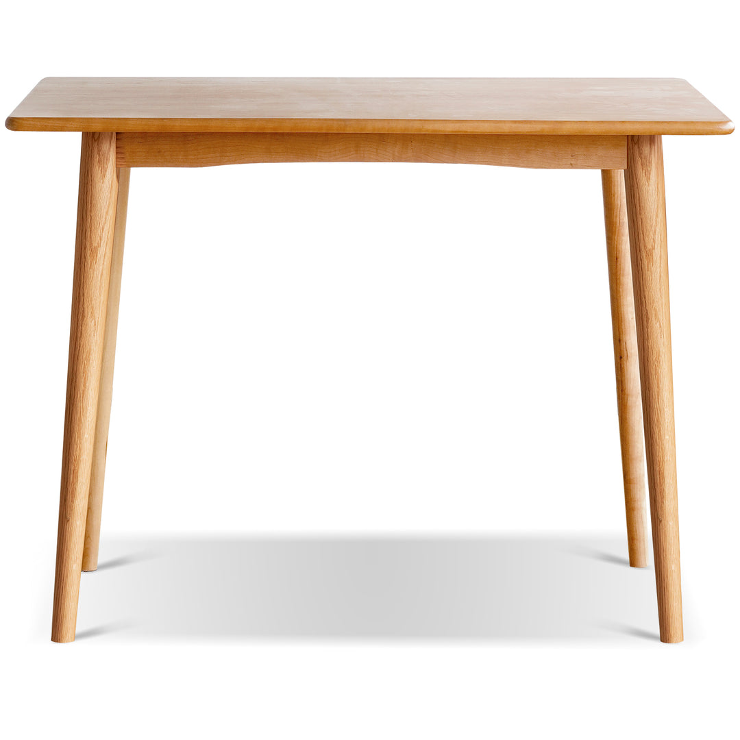 Scandinavian oak wood dining table green in still life.
