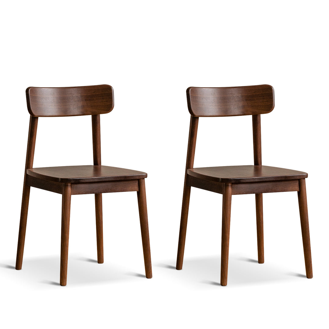 Vintage walnut wood dining chair green in still life.