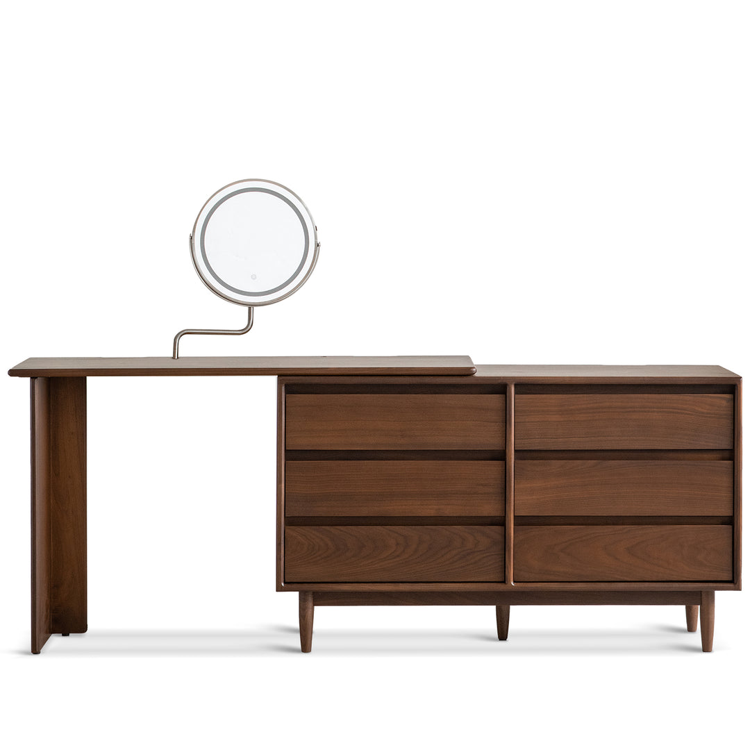 Vintage walnut wood dressing table vista in white background.