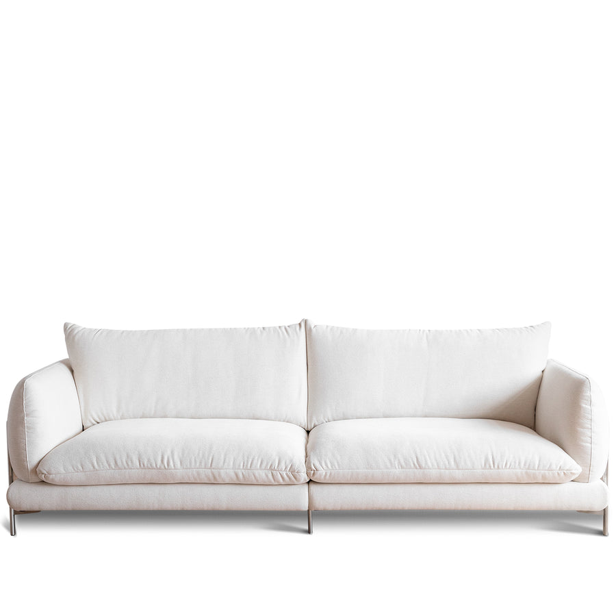 Minimalist cotton fabric 4 seater sofa como in white background.
