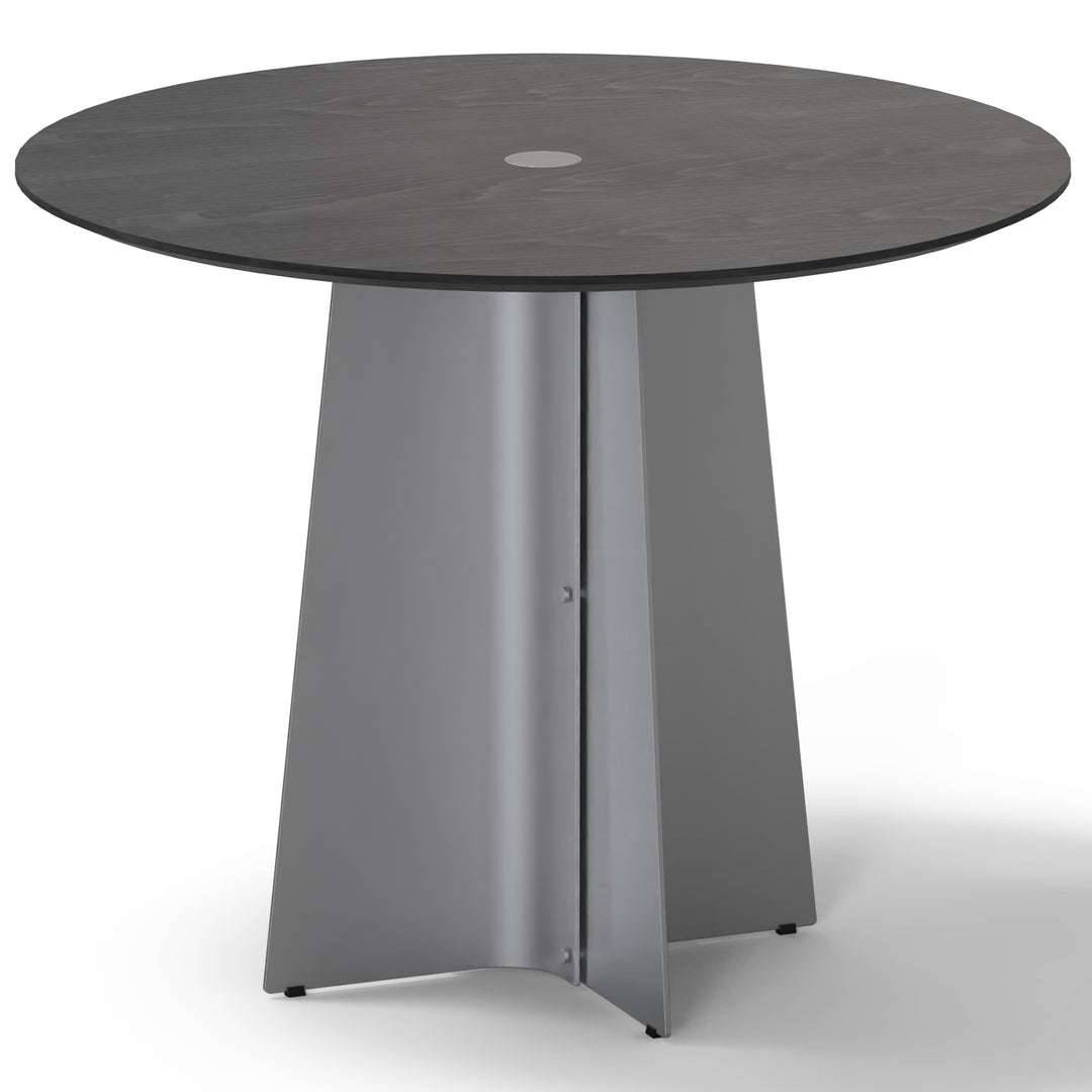 Minimalist ash wood veneer stainless steel round dining table black aeri in still life.