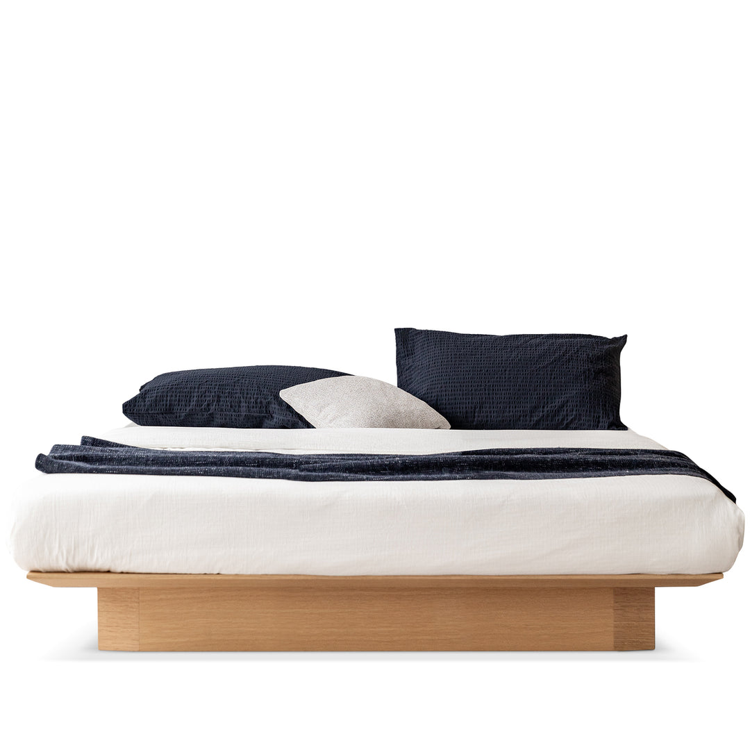 Minimalist ash wood veneer platform floating bed winter environmental situation.