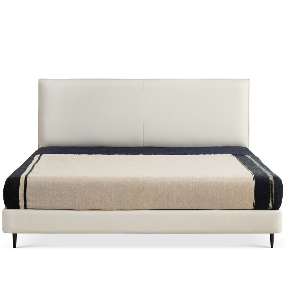 Minimalist genuine leather bed lalo in white background.