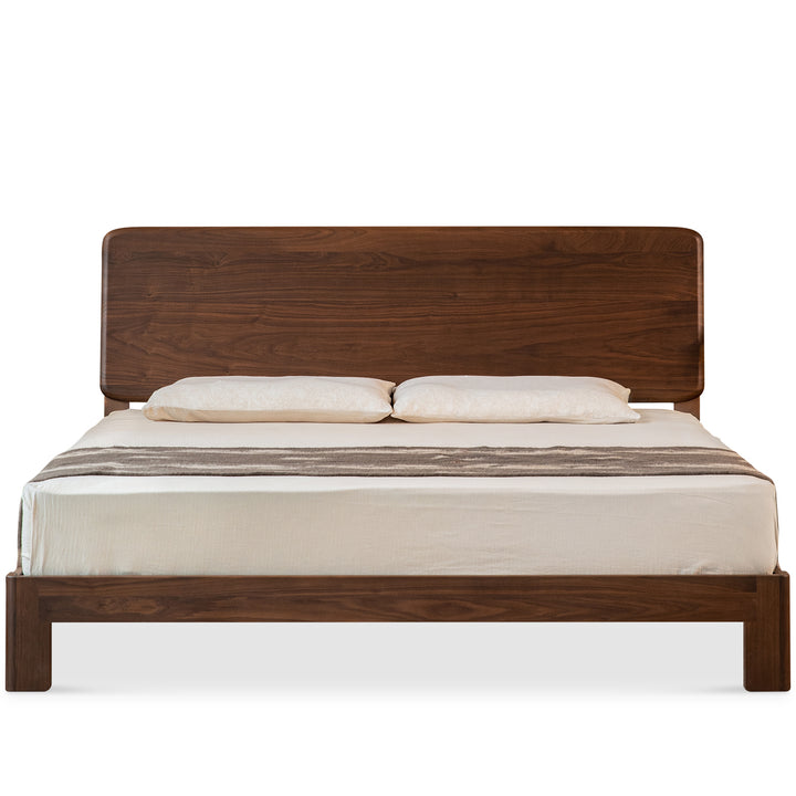 Japandi walnut wood bed dune in white background.